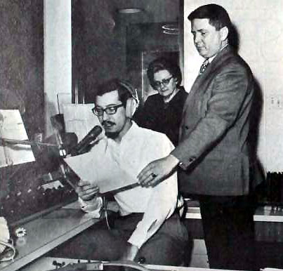 December 1968 - Charlie Parker and WDRC Music Director Bertha Porter look on as midday host John Rode reads a piece of copy