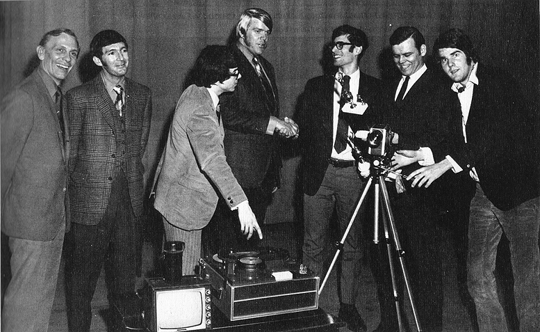 (L-r): Danny Clayton; the Real Tom Jones; Mike Greene; Big Bill Love; A. Burstein, president of the Student Advisory Council; Mr. Fish, principal; and Ray Dunaway congratulate New Briatin High School on winning the school spirit contest (circa early 1970).